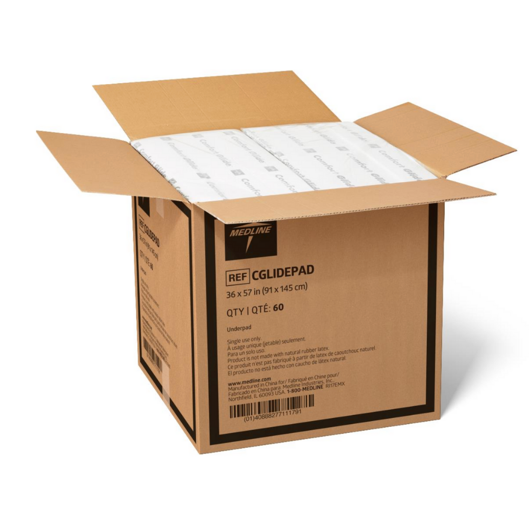 An open box of Medline ComfortGlide Drypad Underpads - XL reveals white absorbent pads. The box lists the size as 36 x 57 in (91 x 145 cm) and contains 60 pads, designed to support moisture management and skin integrity.