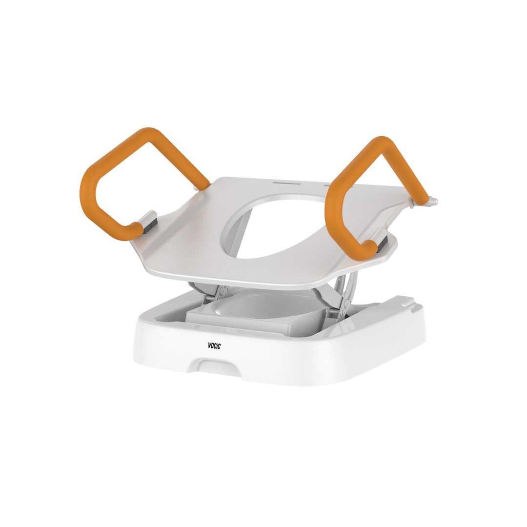 White medical commode chair featuring orange handlebars, an open seat, and an adjustable base, designed for assisted toileting and compatible with the Comfort Steady Powered Toilet Seat Lifter | VOCIC AX12 system.