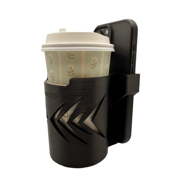 The ComfyGo Cup & Phone Holder Combo for ComfyGo Chairs, in black with a geometric cutout design, holds a paper coffee cup and features an attached phone holder displaying a black smartphone against a white background.