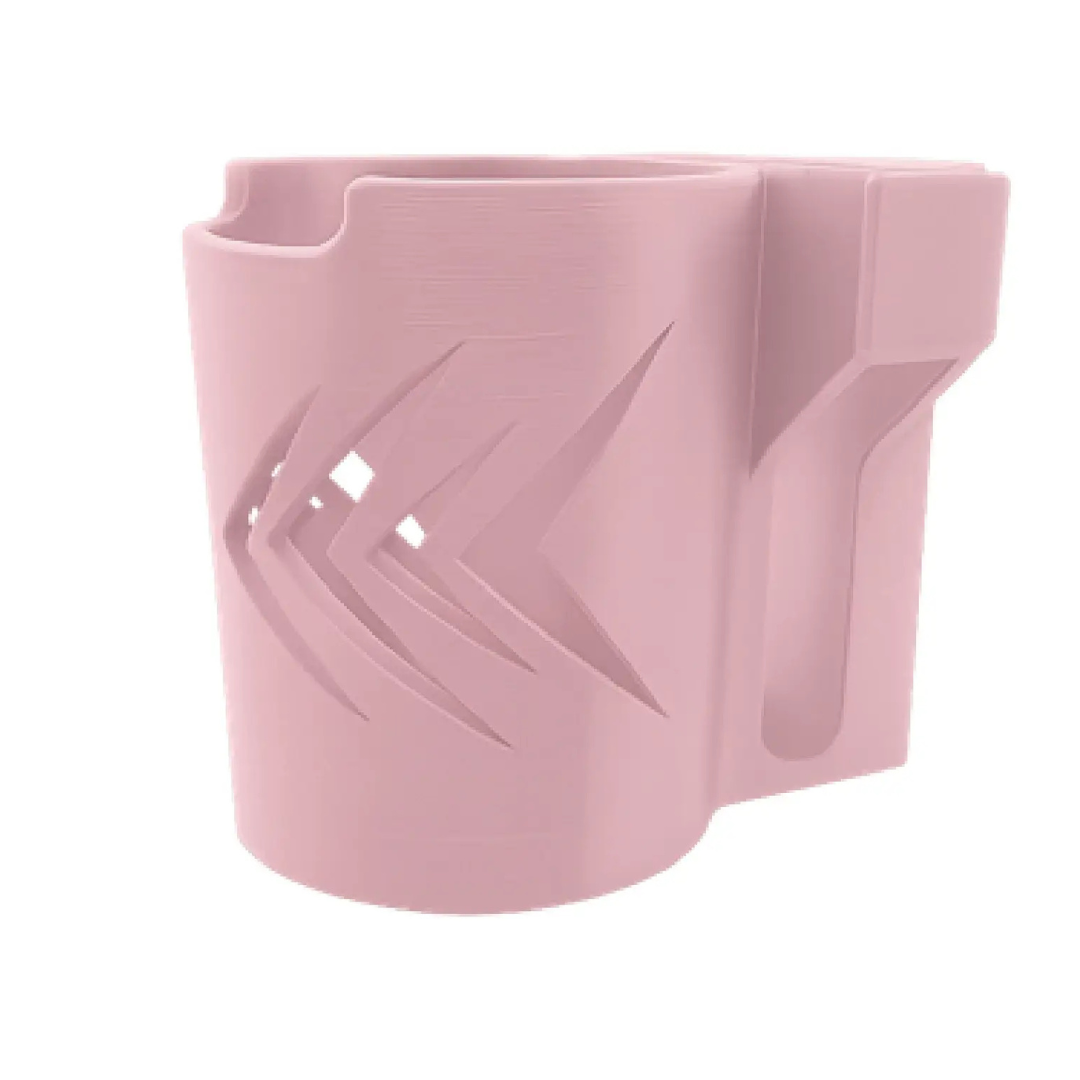 The ComfyGo Cup & Phone Holder Combo for ComfyGo Chairs is a pink plastic holder with arrow-like cutouts and a side compartment, ideal as a cup and phone holder on mobility scooters or electric wheelchairs.