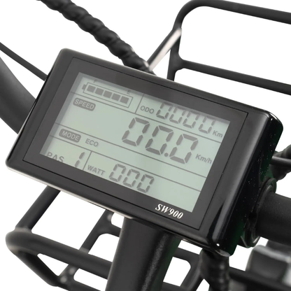 Close-up of the SW900 digital display on the ComfyGo FORTE Electric Tricycle shows speed, battery level, odometer, mode, and watt indicators. The display is handlebar-mounted with a metal basket in the background.