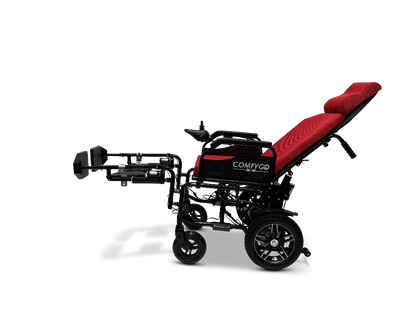 The ComfyGo X-9 Remote Controlled Powerchair, available in a sleek red and black design, features an automatic reclining backrest and leg support. Its large rear and nimble front wheels ensure exceptional mobility and comfort, while the remote control offers effortless operation.