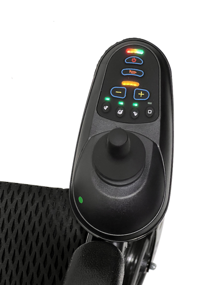 Close-up of a joystick control on the ComfyGo X-9 Remote Controlled Powerchair - Automatic Reclining, featuring buttons for power, speed adjustment, and functions. The sleek black armrest has a perforated design for modern mobility solutions.
