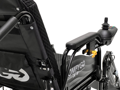Close-up of the ComfyGo X-9 Remote Controlled Powerchair featuring a joystick on the right armrest, a mesh fabric backrest with a pocket, and sleek white text on the frame. Part of the seat support is visible, highlighting this sophisticated mobility solution.