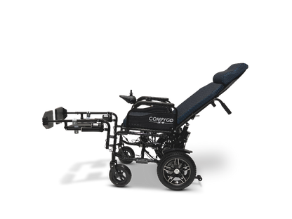 A side view of the sleek black ComfyGo X-9 Remote Controlled Powerchair showcases its reclined backrest and extended footrests. The textured dark fabric seat bears the ComfyGo branding. This four-wheel mobility solution offers remote-controlled, adjustable design for optimal comfort.