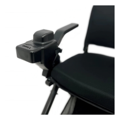 Close-up of the Controller Cover for Whill C2/F Powerchairs, displaying the joystick, mobility control buttons, and durable hard shell protection over the controller. The seat and backrest are also partially visible.