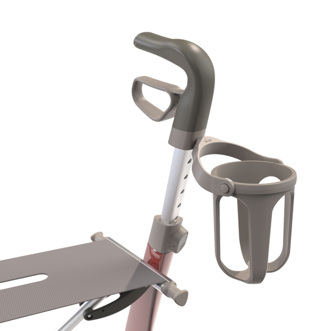 Close-up of a Cup Holder For ByAcre Rollators attached to the handle, with part of the seat visible. Designed for convenience, it features an adjustable fit. The colors shown are mainly grey and red.