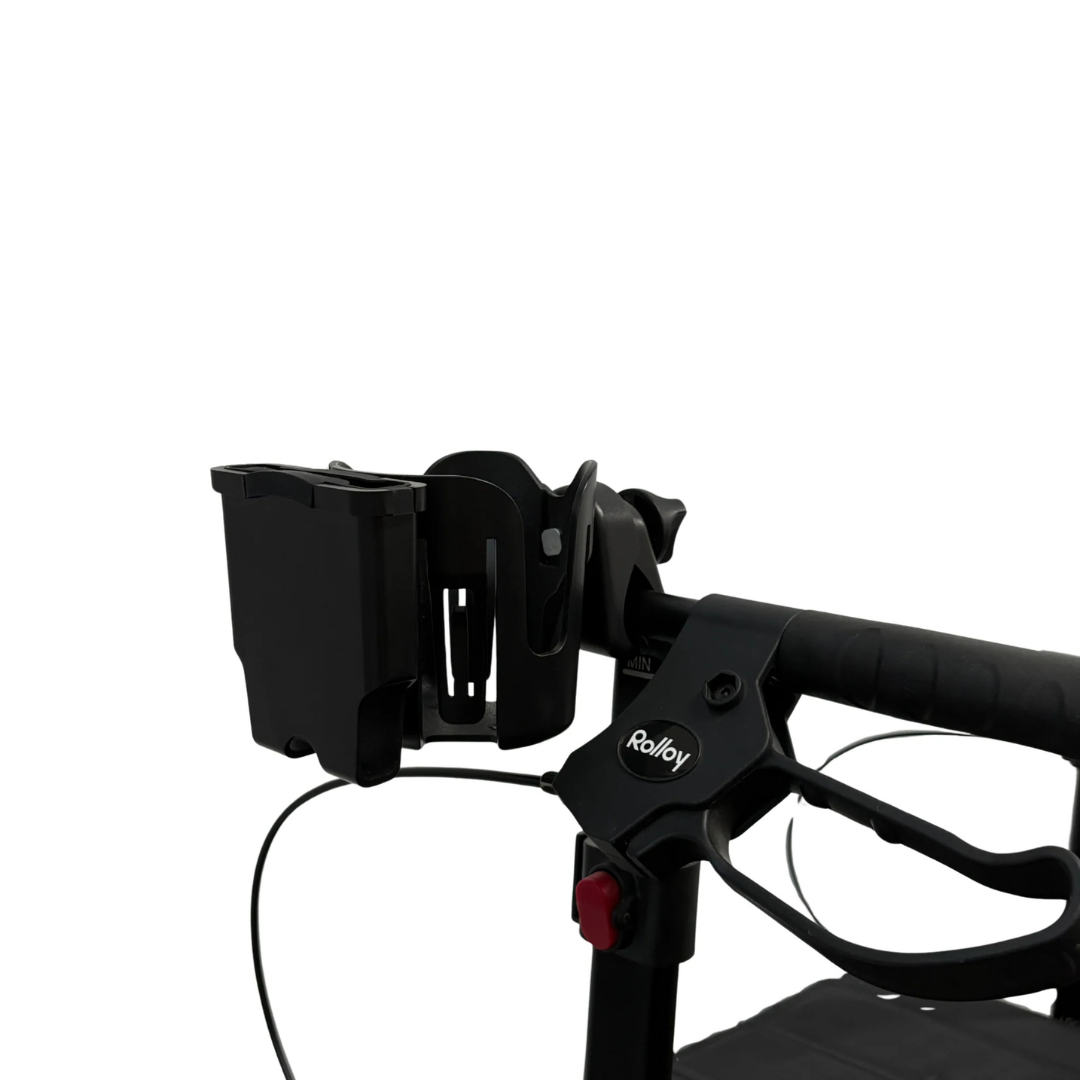 Close-up of a black handle on a Rolloy rollator, showcasing the Cup/Phone holder for Rolloy Rollators and a rectangular mobility accessory, set against a plain white background.