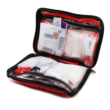 The DMI 298-Piece Complete Emergency First Aid Kit is unzipped and open, showing bandages, scissors, adhesive strips, and other supplies neatly organized in transparent compartments for quick access.