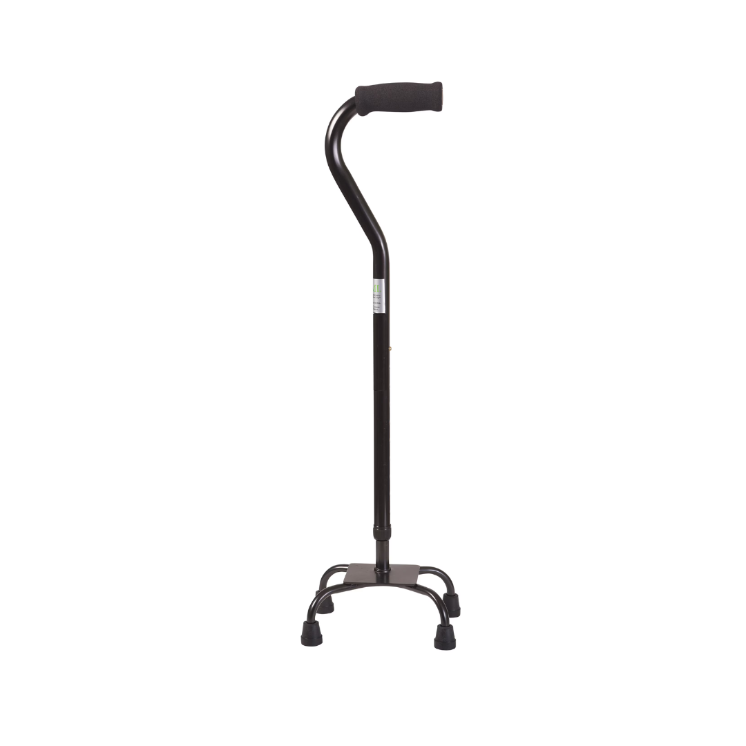 The DMI Adjustable Quad Cane, featuring a black finish, padded handle, adjustable height, and four rubber-tipped feet for stability, stands upright against a white background.