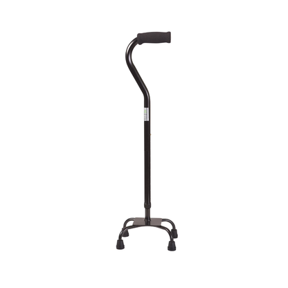 The DMI Adjustable Quad Cane, featuring a black finish, padded handle, adjustable height, and four rubber-tipped feet for stability, stands upright against a white background.
