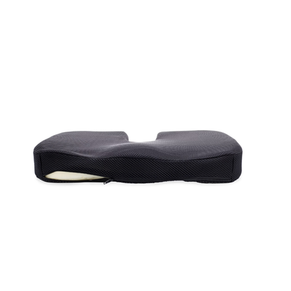 The DMI Premium Coccyx Seat Cushion is a black, ergonomic seat cushion with a contoured design and zippered cover for tailbone pain relief, shown in a side view against a white background.