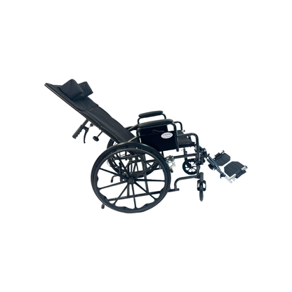 The Dalton Medical Deluxe Recliner Wheelchair, shown from the side against a white background, features a black frame, reclining backrest, elevated leg supports, and large rear wheels.