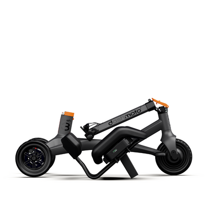 The Dashmoto High Performance Dash 3 Airlize Approved Travel Scooter is a modern, compact, foldable three-wheel scooter with a dark gray frame, orange handlebar and rear fender accents, and a powerful 48V Lithium-ion battery for easy portability.