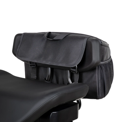The Saddle Bag For Dashmoto Dash 3 Scooter is a black fabric backrest bag designed to attach easily behind the padded seat of your scooter. Featuring a convenient flap closure, handy side pockets, and a sturdy top handle, this saddle bag is the perfect mobility accessory for carrying your essentials on the go.