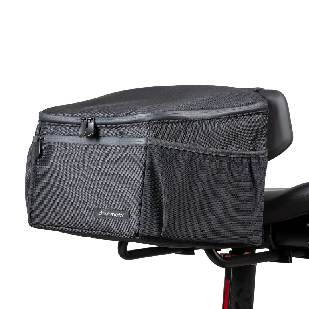 The Saddle Bag For Dashmoto Dash 3 Scooter is a black, Dashmoto-branded tail bag featuring a zippered main compartment and side pockets that attaches to the rear seat of your motorcycle, making it a versatile mobility accessory for your Dashmoto Dash 3 scooter.