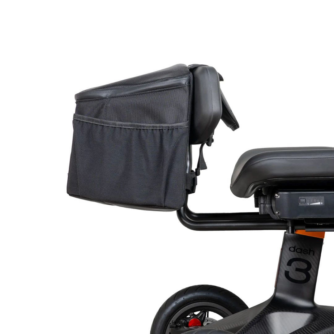 A close-up of the Saddle Bag For Dashmoto Dash 3 Scooter, a black cargo bag designed specifically as a scooter saddle bag, attached securely to the rear of an electric bike just behind the seat and above the rear wheel—ideal for carrying all your essential mobility accessories on every ride.