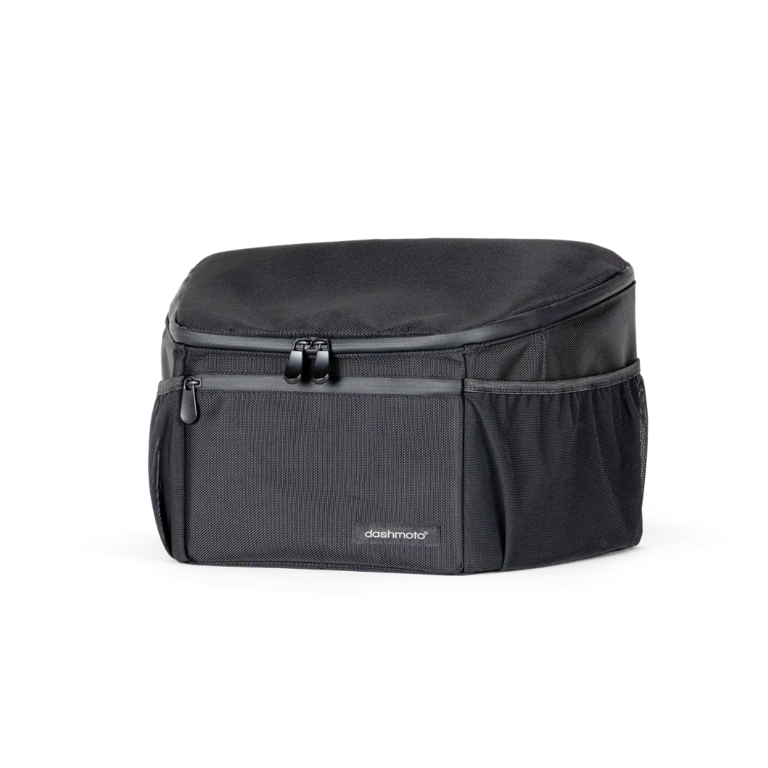 The Saddle Bag For Dashmoto Dash 3 Scooter is a black, rectangular, soft-sided saddle bag featuring a zippered top, front pocket, and mesh side pockets. Designed as an essential mobility accessory for the Dashmoto Dash 3 scooter, it displays the brand name “dashboard” on the front and is shown against a white background.