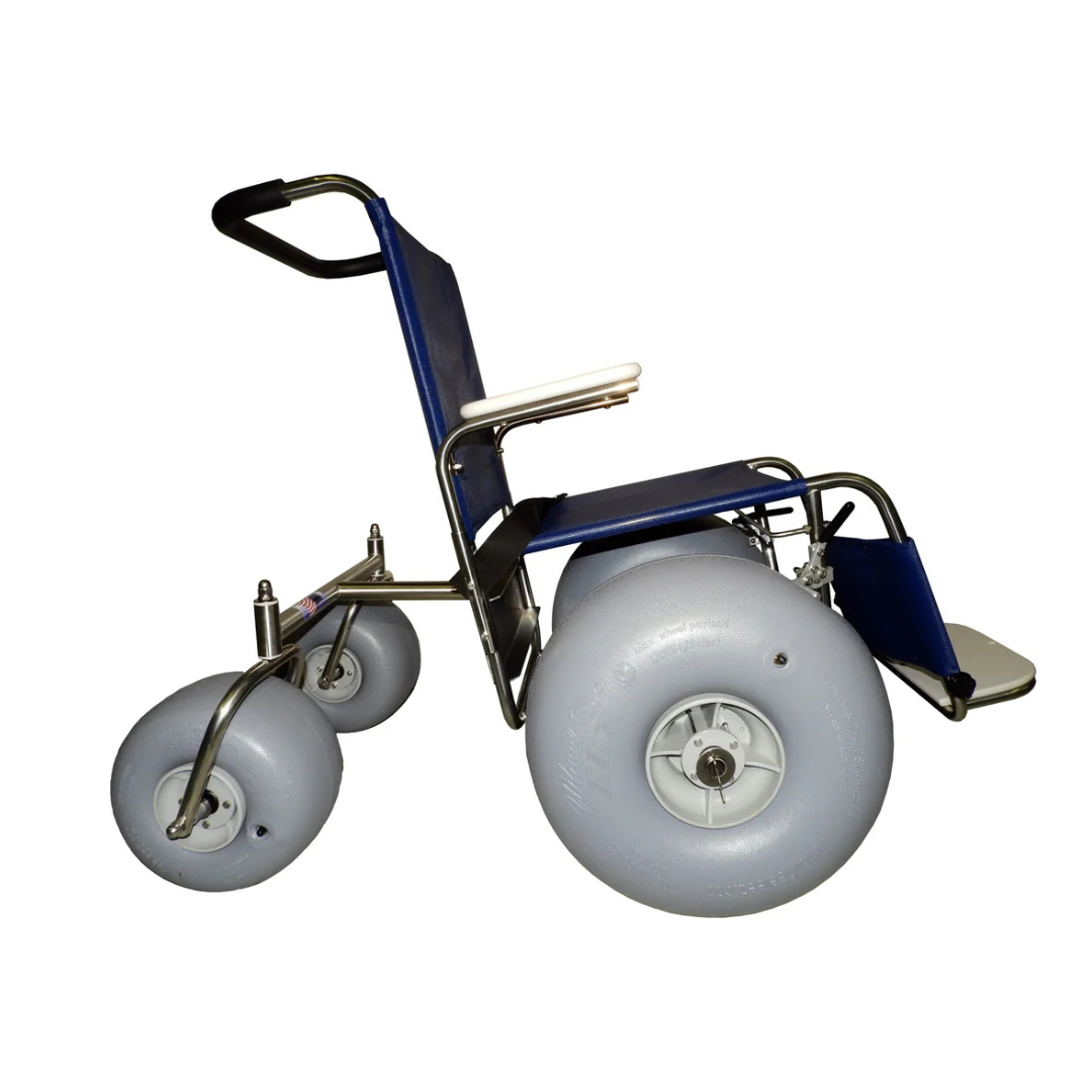 The DeBug All-Terrain Beach Wheelchair, shown in a side view, features a blue and silver frame with large, wide gray wheels designed for easy outdoor mobility on sand or rough terrain.