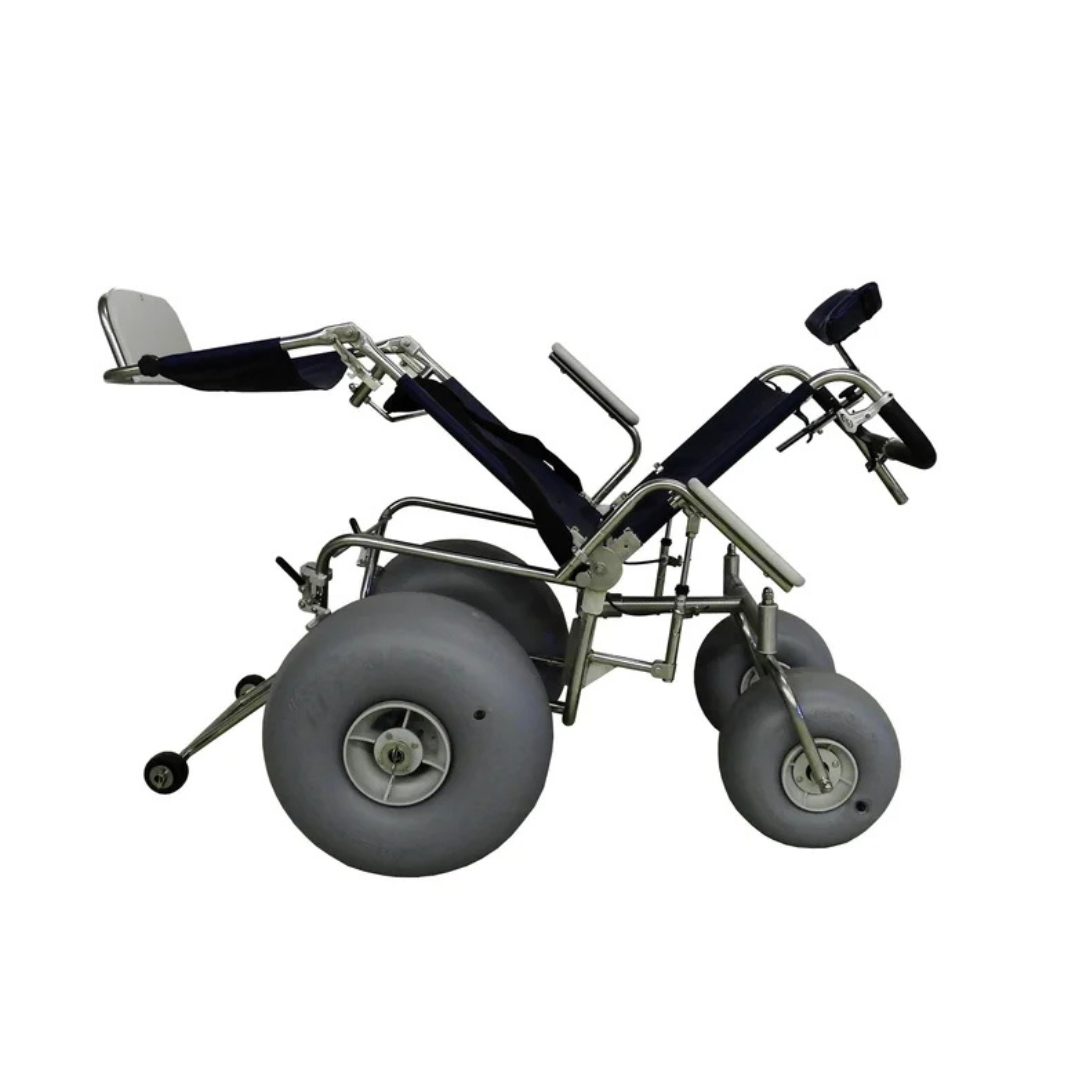 The DeBug All-Terrain Beach Wheelchair features large gray wheels, a reclining seat, and a sturdy metal frame with dark fabric seating and armrests, making outdoor mobility on sand easier and more comfortable.