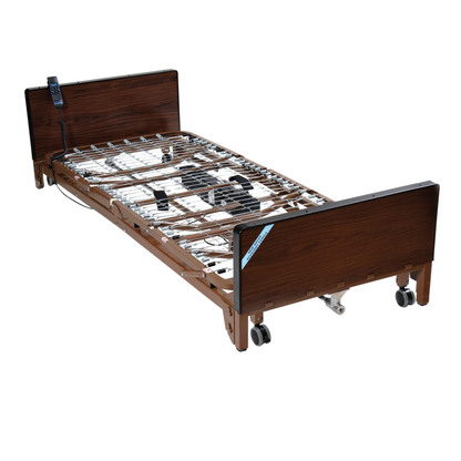 The Drive Delta® Ultra-Light 1000 Bariatric Full-Electric Low Bed features a sturdy metal frame and smooth-rolling wheels.