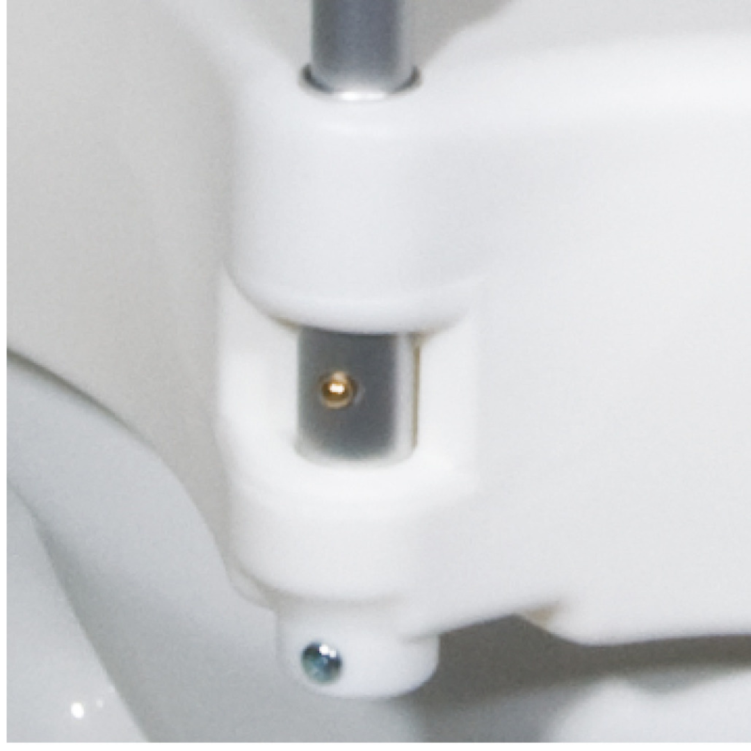 Close-up of the hinge mechanism on the Drive 2-in-1 Locking Raised Toilet Seat with Removable Arms (5" Rise), showing clearly visible white plastic, metal bolt, and screw as part of the seat or lid assembly.