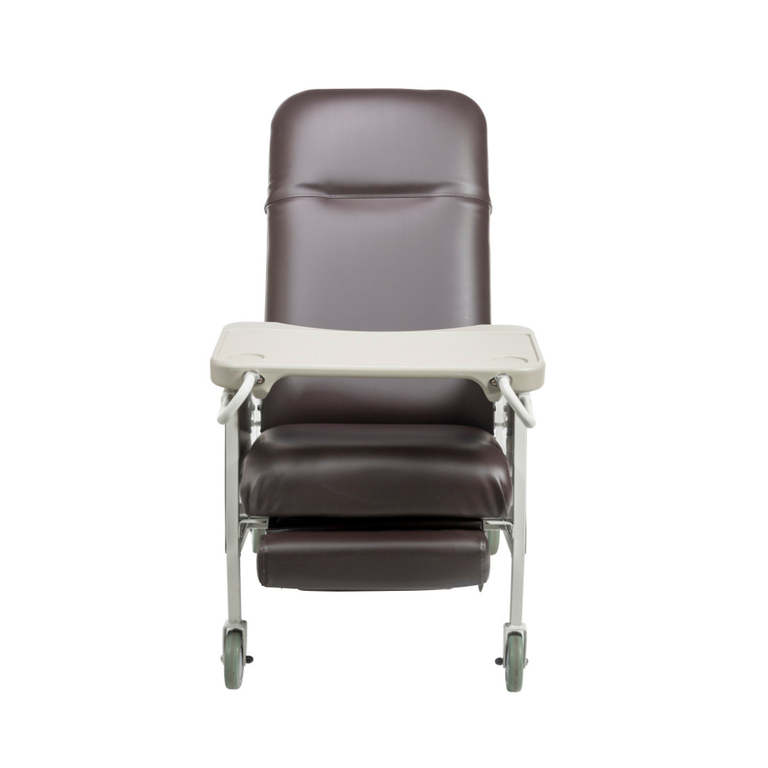 The Drive 3-Position Geri-Chair Recliner with Wheels features a high back, padded seat, extendable footrest, wheeled legs, and a white tray attached to the armrests—perfect for patient care in hospitals or home settings.