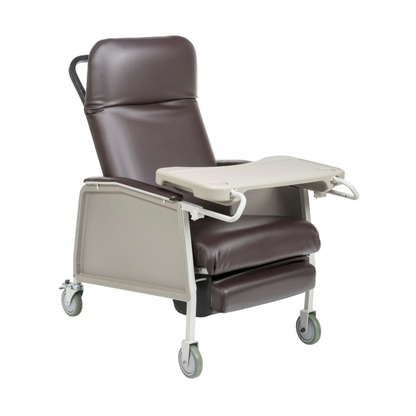 The Drive 3-Position Geri-Chair Recliner with Wheels features dark brown cushioned upholstery, foldable beige tray arms, and easy mobility—making it an ideal patient care chair for comfort and convenience during recovery.
