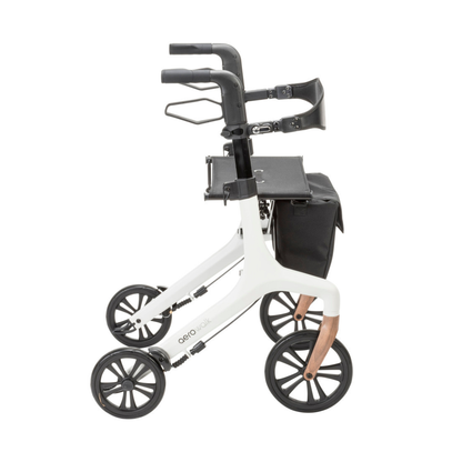 The Drive AeroWalk Ultra-Lite Rollator offers modern mobility support with four wheels, ergonomic handles, a black seat, a black front storage bag, and a white frame with copper-accented rear legs for stylish and lightweight use.