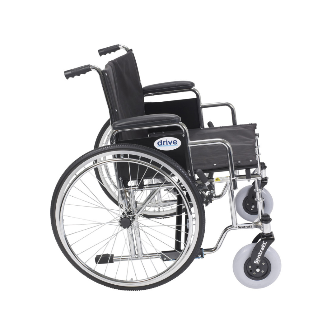 The Drive Bariatric Sentra EC Heavy-Duty Extra-Wide Wheelchair is shown in side view, featuring a black metal frame, large rear wheels, small front casters, armrests, and footrests. The "drive" brand name is visible on the side.