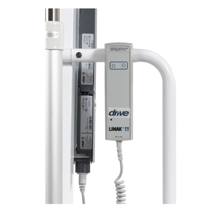 Close-up of a Drive Bariatric Battery-Powered Patient Lift control panel labeled "drive" and "LINAK," featuring up/down arrow buttons, coiled cable, visible electrical parts, and attached to the lift's white metal frame.