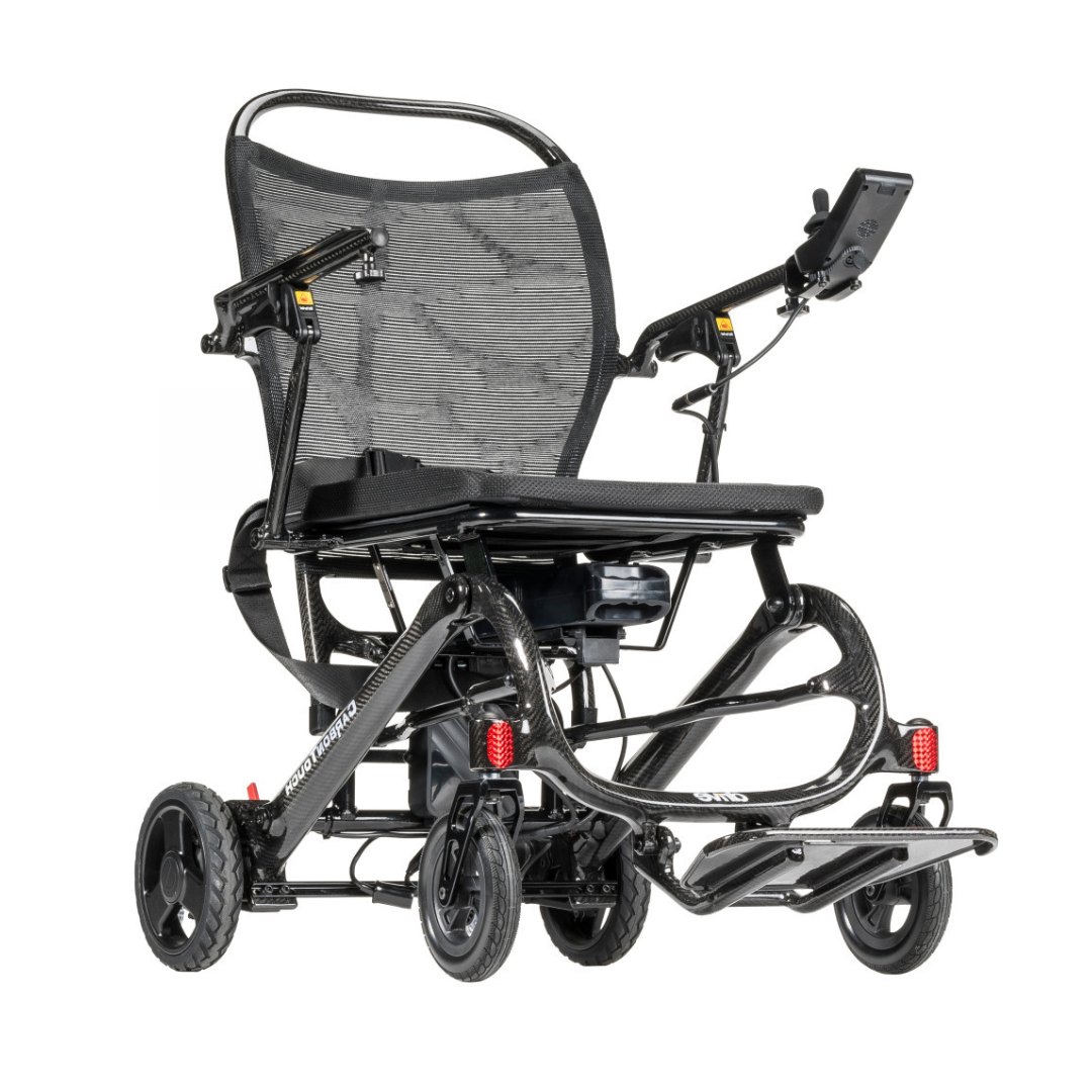 Lightweight and foldable, the Drive CarbonTouch Power Wheelchair features a mesh backrest, padded seat, convenient joystick control on the armrest, footrest, small front and rear wheels, and a compact black frame—making it an ideal lightweight power wheelchair for easy transport and everyday use.