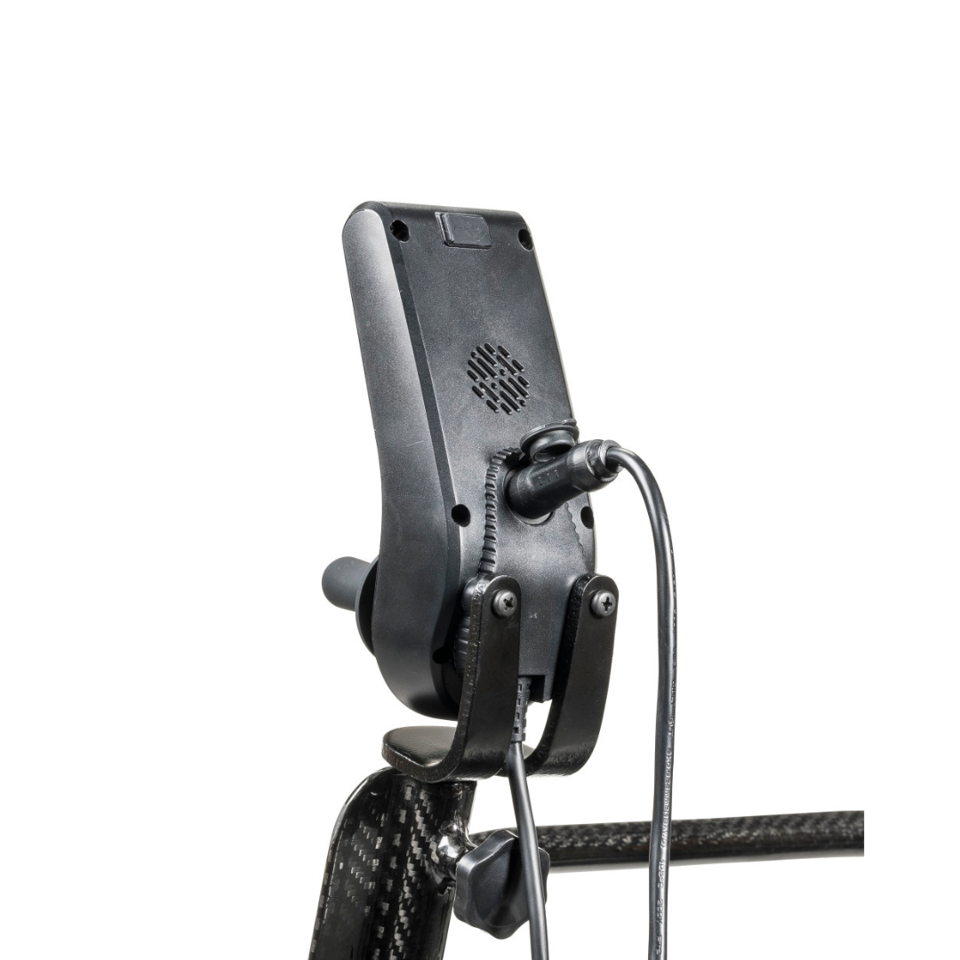 Black electronic device mounted on a carbon fiber frame, with attached coiled and straight cables, shown from the back against a white background—a design reminiscent of the Drive CarbonTouch Power Wheelchair, known for its lightweight build and advanced technology.