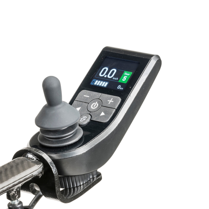 Close-up of a black electronic joystick controller for the Drive CarbonTouch Power Wheelchair, featuring a display screen showing numbers and icons, designed for this mobility device, isolated on a white background.