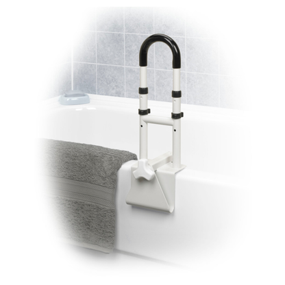 The Drive Clamp-On Tub Rail - Safety Handle, in white and black, is securely clamped to a white bathtub edge for tool-free support. A folded gray towel sits nearby, with light blue tiled walls in the background.