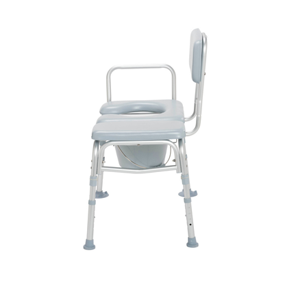 Side view of the Drive Combination Padded Transfer Bench/Commode in light blue and white, featuring armrests, an open-centered padded seat, a removable bucket below, and adjustable rubber-tipped legs for enhanced stability.