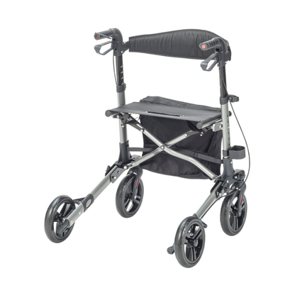 The Drive Lightweight Portable Rollator - Ultra Compact Fold features a silver/black frame, four wheels, hand brakes, padded seat, storage pouch under the seat, and folds compactly for easy transport.