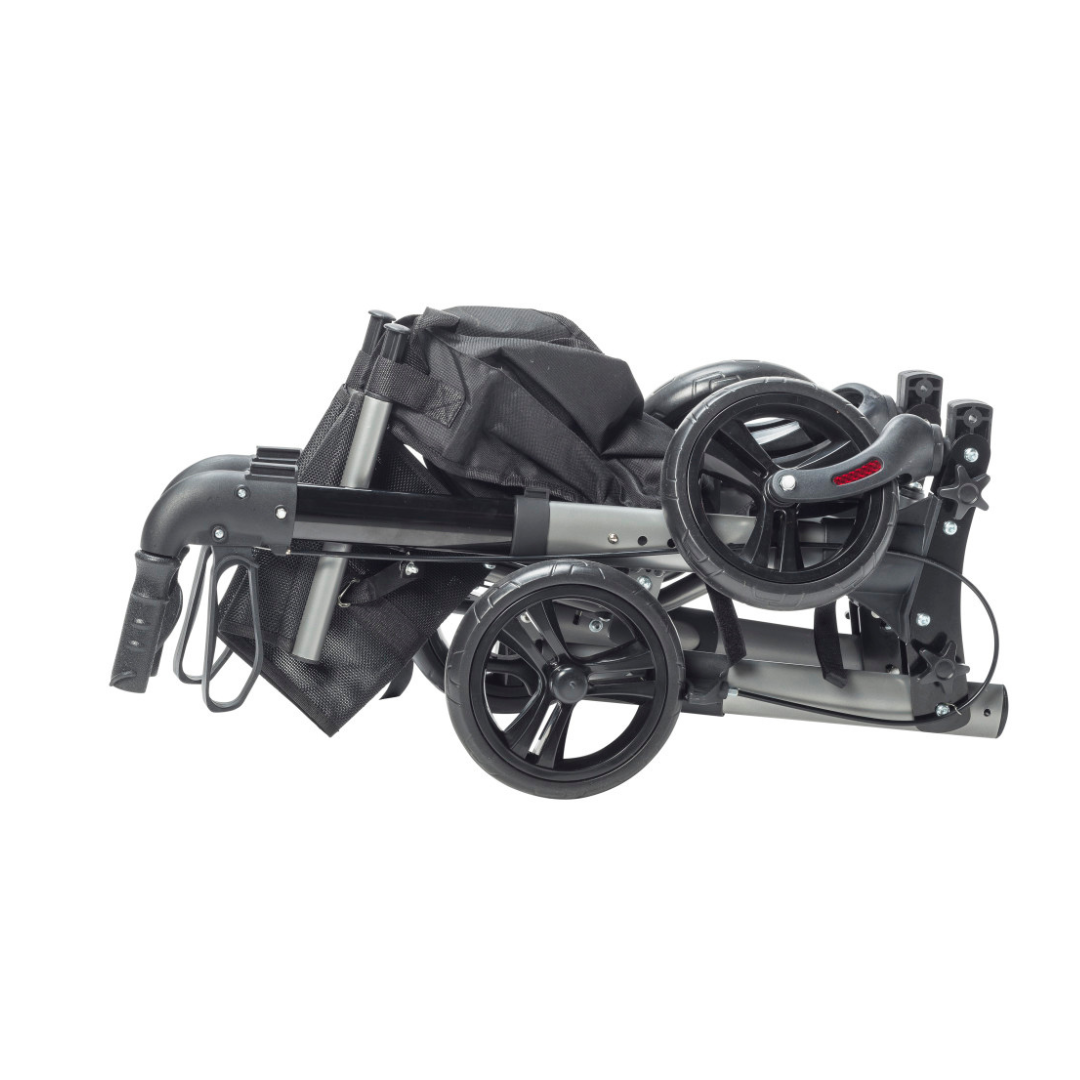 A Drive Lightweight Portable Rollator - Ultra Compact Fold in black and gray is shown folded, with its handles, frame, and fabric parts neatly collapsed together for portability.
