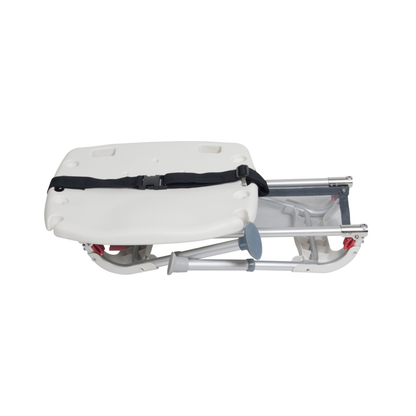 The Drive Folding Universal Bathtub Sliding Transfer Bench, shown collapsed for easy storage, features a white and gray seat, black safety strap, and metal frame—ideal for safe tub entry and exit like a foldable booster seat.