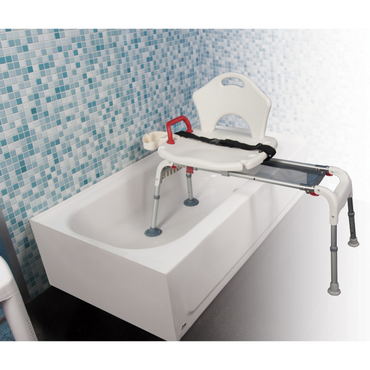 The Drive Folding Universal Bathtub Sliding Transfer Bench, in white and gray with backrest and arm handle, is set over a bathtub by blue and white tile, providing safer entry and exit.