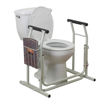 The Drive Free-standing Toilet Safety Rail is shown on a white toilet. It features armrests, support bars, and a left-side magazine holder to assist seniors or users with mobility and balance issues in the bathroom.