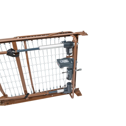 A close-up of the Drive Full Electric Low Height Homecare Bed’s underside shows its metal frame, wiring, and electric motor systems that raise and lower the bed.