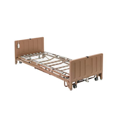 The Drive Full Electric Low Height Homecare Bed is a brown adjustable hospital bed frame with metal slats, headboard, footboard, and wheels. It includes a wired remote control for easy use and is pictured without a mattress.