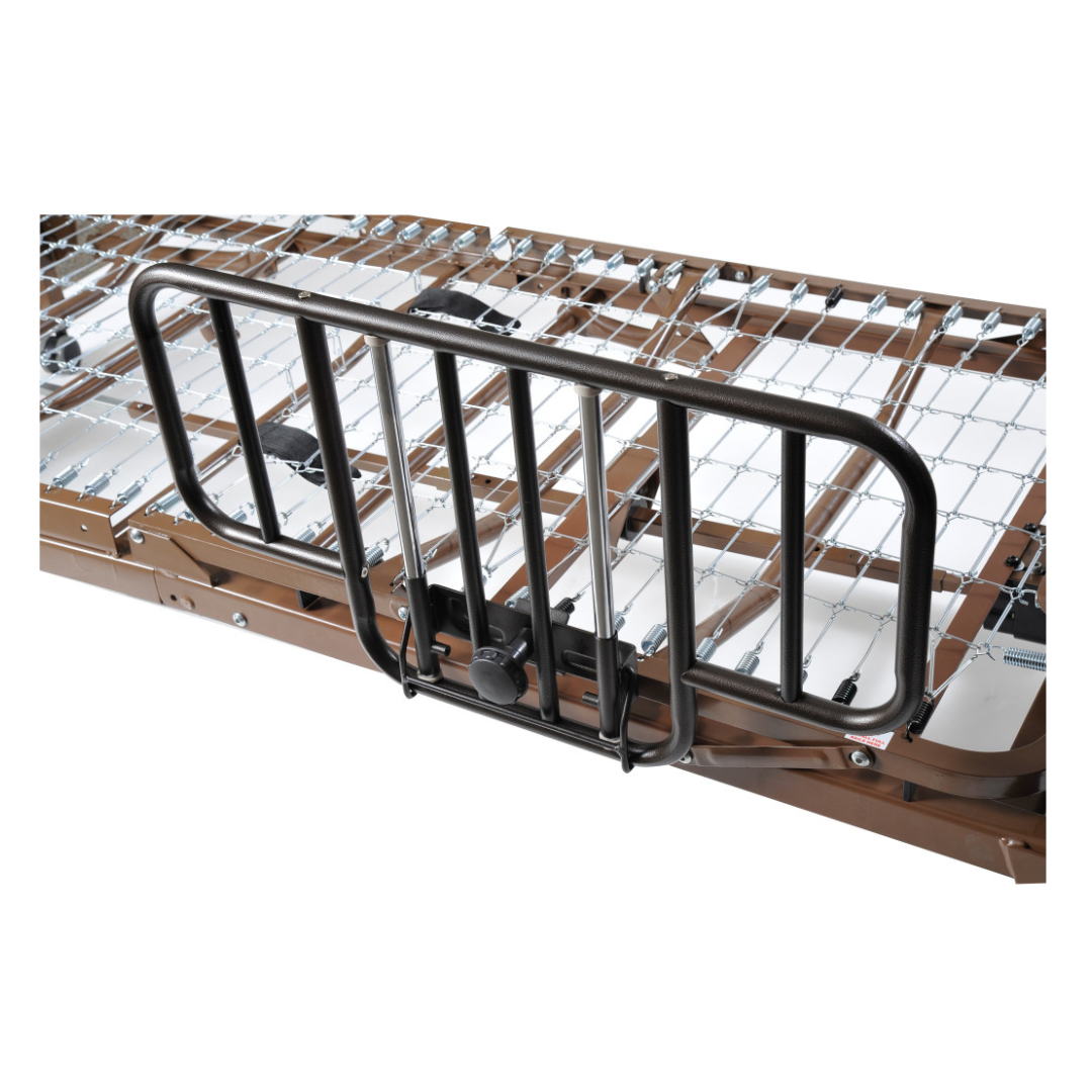 A close-up of Drive Half Length Bed Rails, featuring an anti-entrapment design and sturdy wire grid support, securely attached to the side of a hospital or adjustable bed frame.