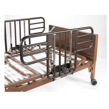 A close-up view of a hospital bed with Drive Half Length Bed Rails, featuring metal rails, a brown frame, wheeled legs, and spring mattress support against a plain white background.