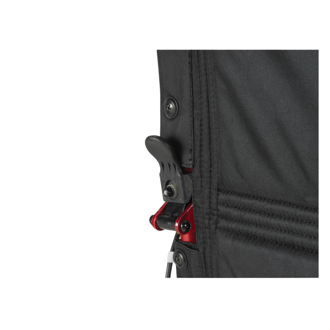 Close-up of Drive Lightweight Expedition Aluminum Transport Chair's black fabric, red and black plastic buckle, and button fasteners—features designed to enhance caregiver mobility in daily use.