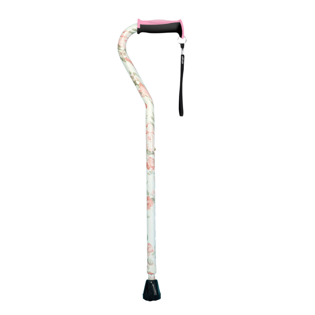 The Drive Airgo Comfort-Plus Aluminum Cane with Offset Handle features a floral pattern, a cushioned pink and black comfort-plus handle, and a black wrist strap—an elegant mobility aid shown upright on a white background.