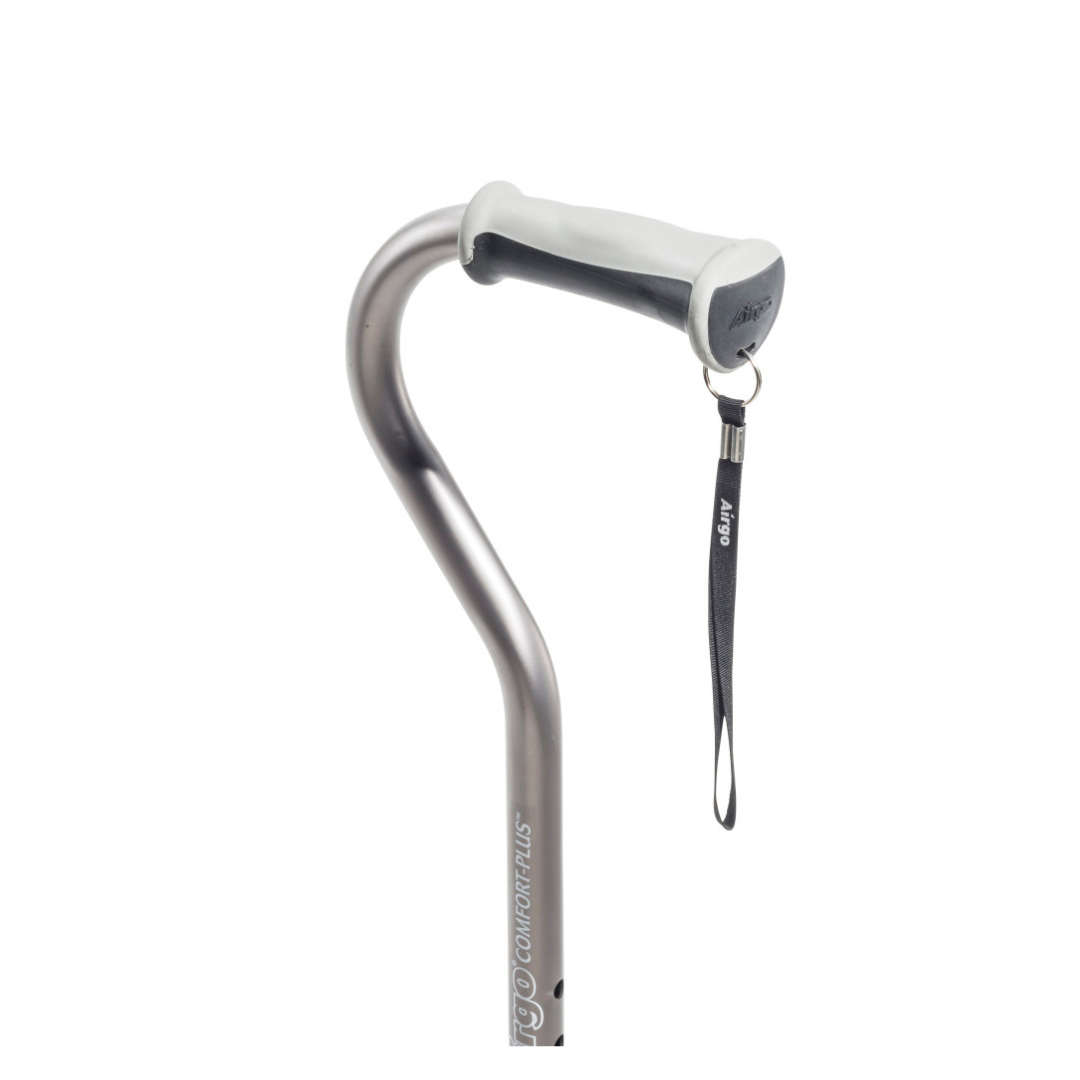 A close-up of a Drive Airgo Comfort-Plus Aluminum Cane with a silver offset handle, curved cushioned comfort-plus grip, and black wrist strap. The ergonomic light gray handle makes it an ideal mobility aid.