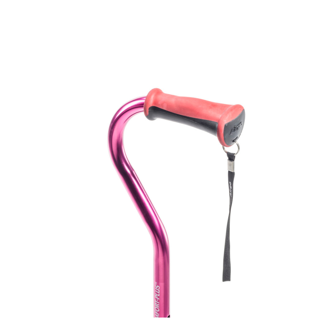 The Drive Airgo Comfort-Plus Cane with MiniQuad Ultra-stable Tip features a pink shaft, curved handle with red rubber grip, black wrist strap, and enhanced stability base, shown on a white background.