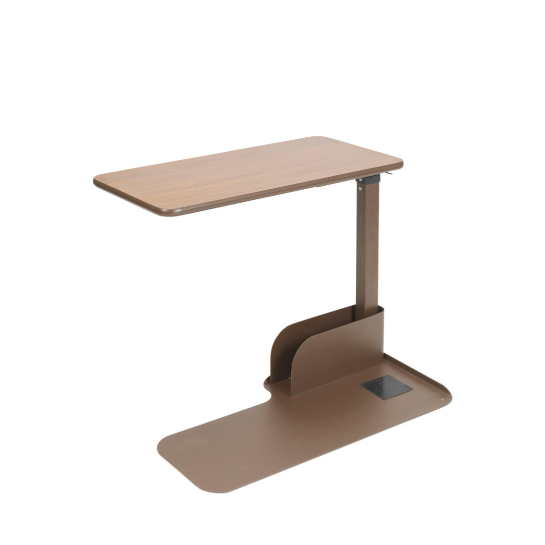 The Drive Couch & Lift Chair Swivel Table features a brown, adjustable-height design with a rectangular wooden top, sturdy metal base, and a pivoting tabletop for convenient use beside beds or chairs.